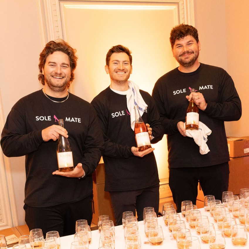 Three Wine Women and Shoes Event Volunteers Holding Rosé